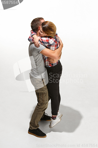 Image of Full body portrait of hugging couple with smile. Caucasian models in love