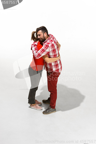 Image of Full body portrait of hugging couple with smile. Caucasian models in love