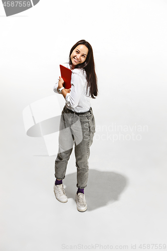 Image of Businesswoman hugging laptop. Love to computer concept.