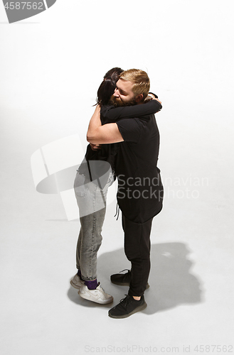 Image of Full body portrait of hugging couple with smile. Caucasian models in love