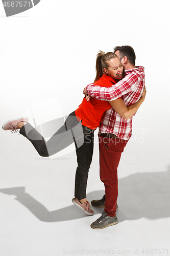 Image of Full body portrait of hugging couple with smile. Caucasian models in love