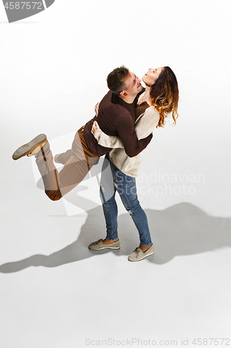 Image of Full body portrait of hugging couple with smile. Caucasian models in love