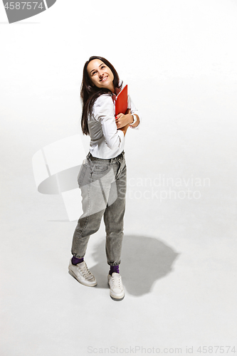 Image of Businesswoman hugging laptop. Love to computer concept.