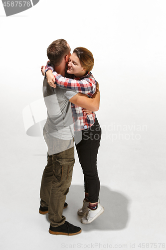 Image of Full body portrait of hugging couple with smile. Caucasian models in love