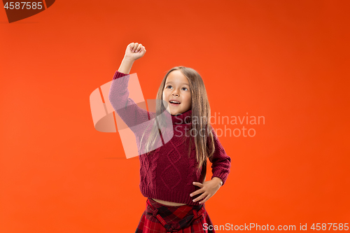 Image of The happy teen girl standing and smiling