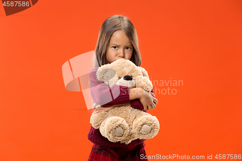 Image of The happy teen girl standing and smiling