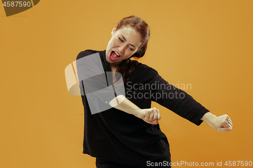 Image of Winning success woman happy ecstatic celebrating being a winner. Dynamic energetic image of female model