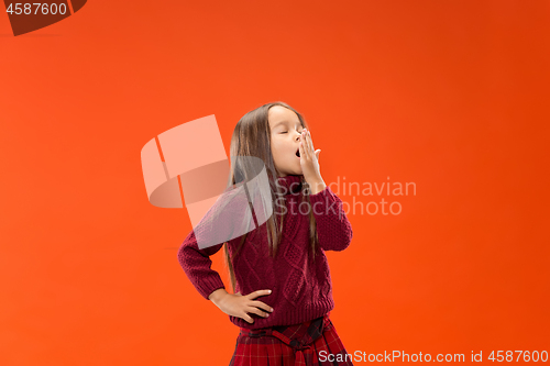 Image of Beautiful bored teen girl bored isolated on studio background