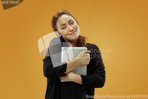 Image of Businesswoman hugging laptop. Love to computer concept.