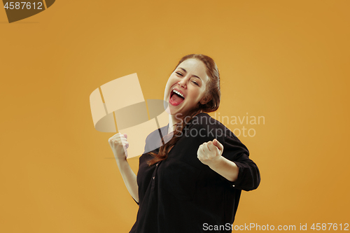 Image of Winning success woman happy ecstatic celebrating being a winner. Dynamic energetic image of female model