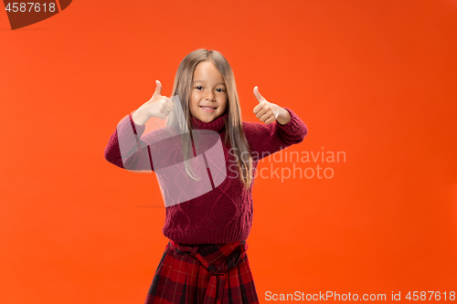 Image of The happy teen girl standing and smiling