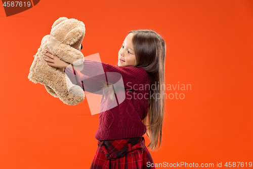 Image of The happy teen girl standing and smiling