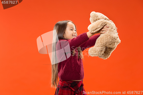 Image of The happy teen girl standing and smiling