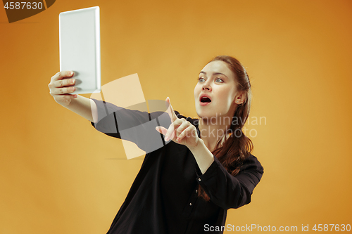 Image of Businesswoman hugging laptop. Love to computer concept.