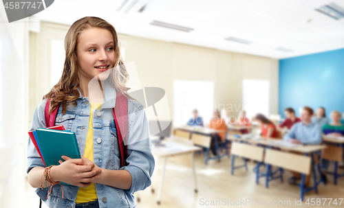 Image of happy smiling teenage student girl with school bag