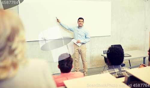 Image of group of students and teacher at lecture