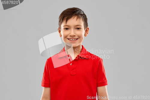 Image of portrait of smiling boy in red t-shirt