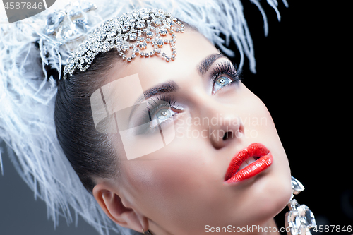 Image of Young Woman In Feather 