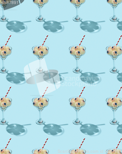 Image of Glass with Halloween cocktail with human eyeballs.