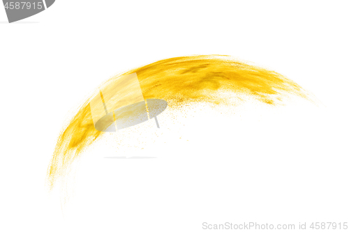 Image of Yellow paint powder explosion on a white background.