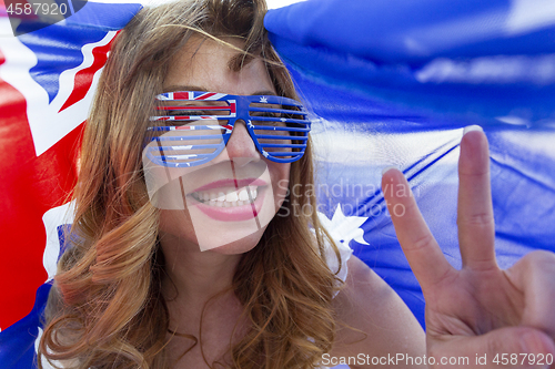 Image of Patriotic woman showing peace sign
