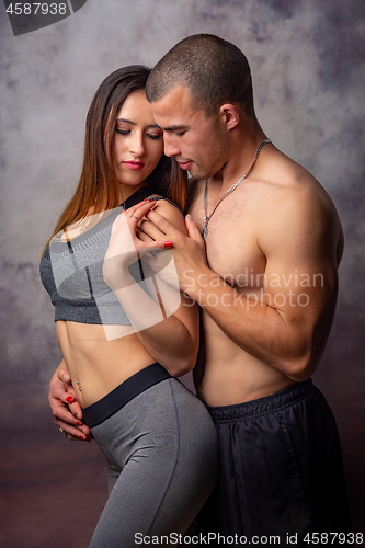 Image of Young athletes hug each other