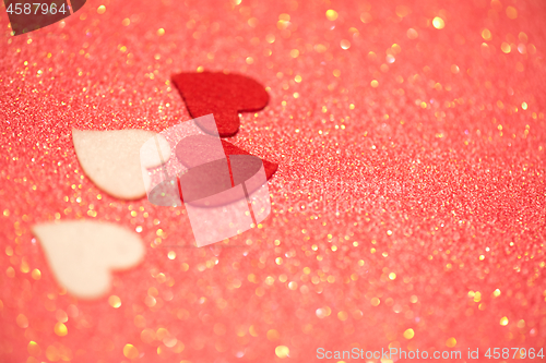 Image of Hearts over pink abstract background with bokeh