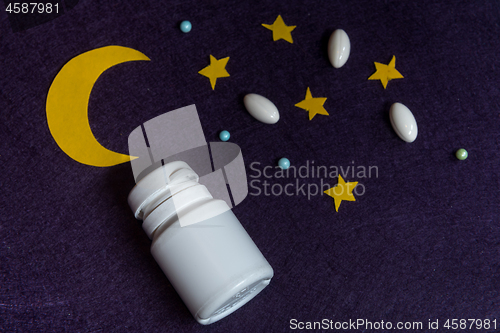 Image of Sky with moon and stars and sleeping pills