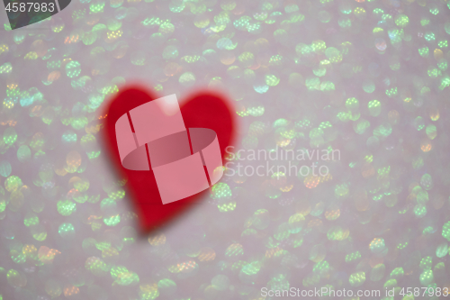 Image of Blurred heart over abstract background with bokeh