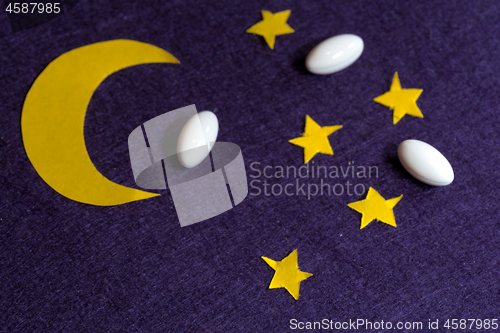 Image of Sky with moon and stars and sleeping pills