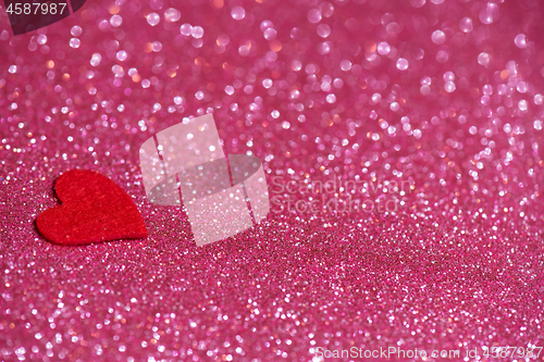 Image of Heart over pink abstract background with bokeh