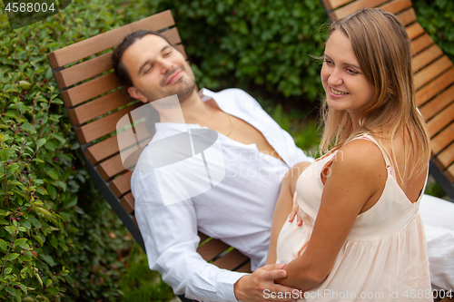 Image of Young man and woman during pregnancy.
