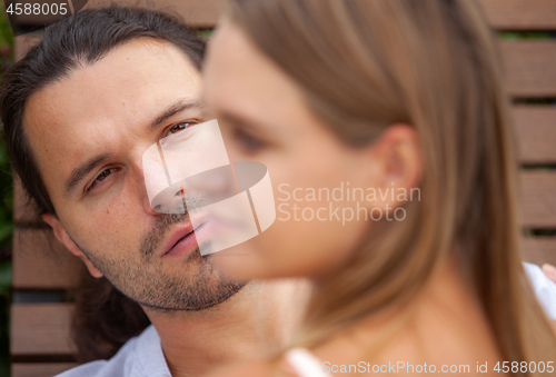 Image of portrait of a man talking to a woman