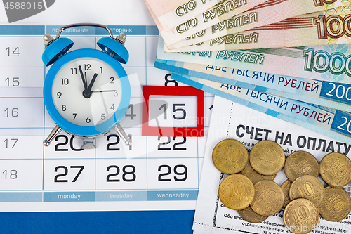 Image of Wednesday\'s 15th, clock, Russian banknotes and coins