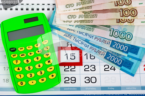 Image of Calendar with a dedicated 15 number, calculator, Russian rubles