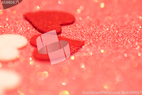 Image of Hearts over pink abstract background with bokeh