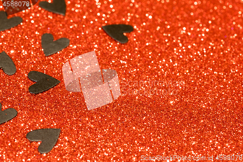 Image of Hearts over red abstract background with bokeh