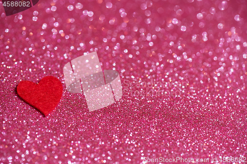 Image of Heart over pink abstract background with bokeh