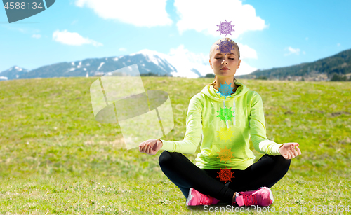 Image of woman doing yoga outdoors