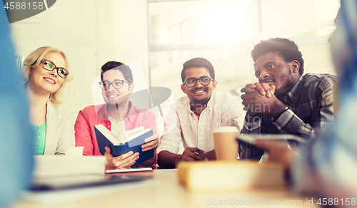 Image of group of high school students sitting at table