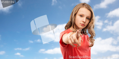 Image of teenage girl in red t-shirt pointing finger to you