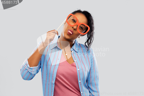 Image of happy african american woman with big glasses