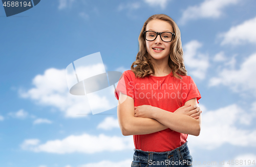 Image of smiling student girl in glasses over sky