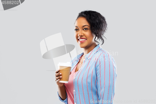 Image of happy african american woman drinking coffee