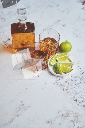 Image of Whiskey sour drink with lemon in glass on stone rustical background