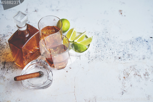 Image of Whiskey sour drink with lemon in glass on stone rustical background