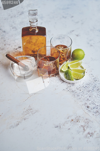 Image of Whiskey sour drink with lemon in glass on stone rustical background