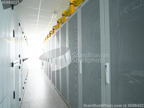 Image of modern server room with white servers