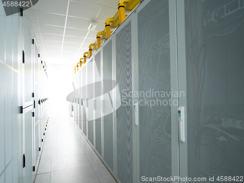 Image of modern server room with white servers