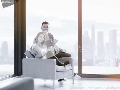 Image of couple using tablet at home